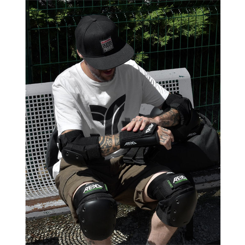 REKD Pro Wrist Guards black pro wrist guards black putting on 1